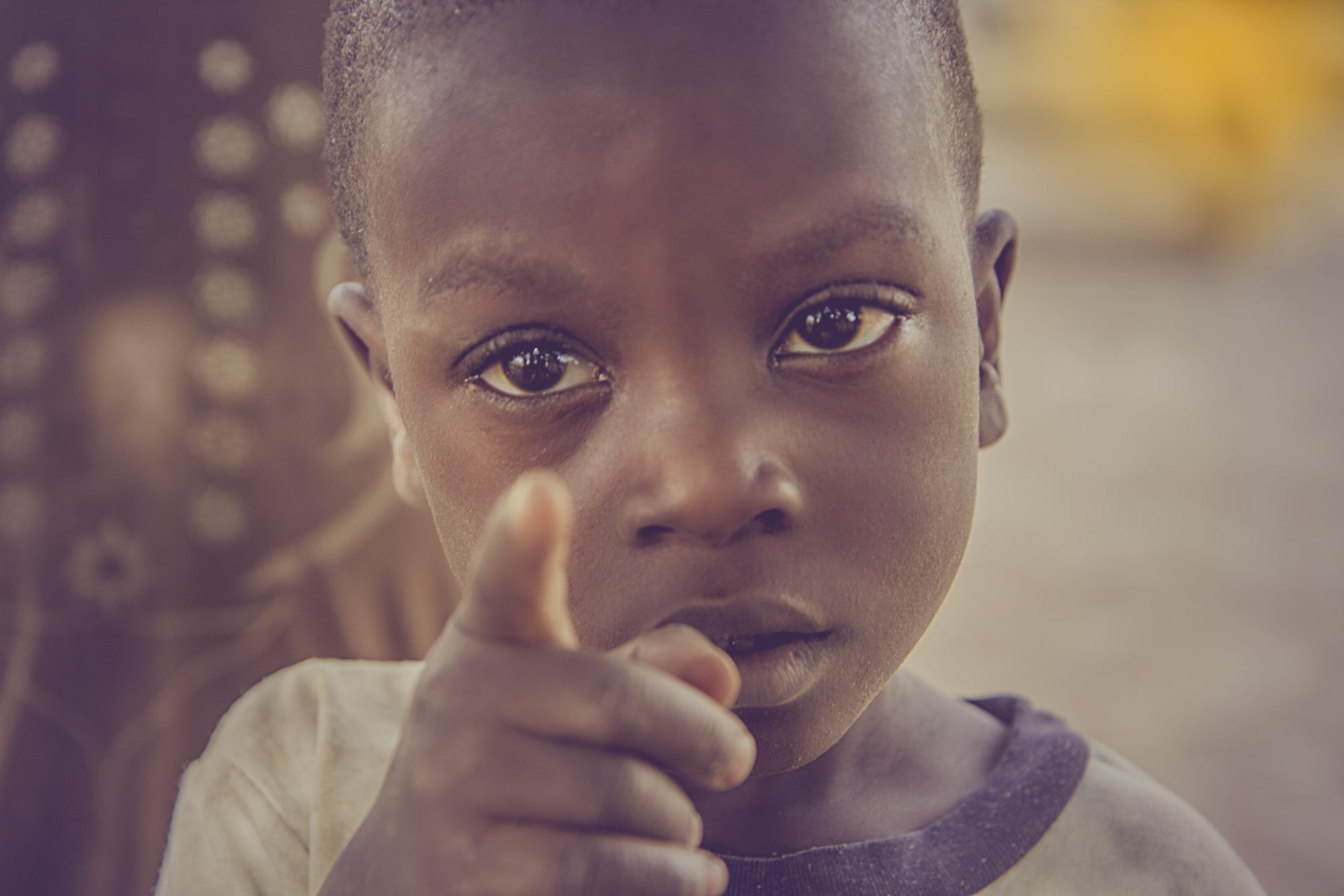 African street child pointing at the camera