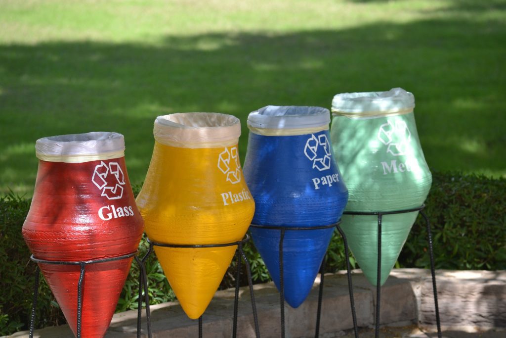 4 brightly coloured recycling bins giving people reasons to recycle