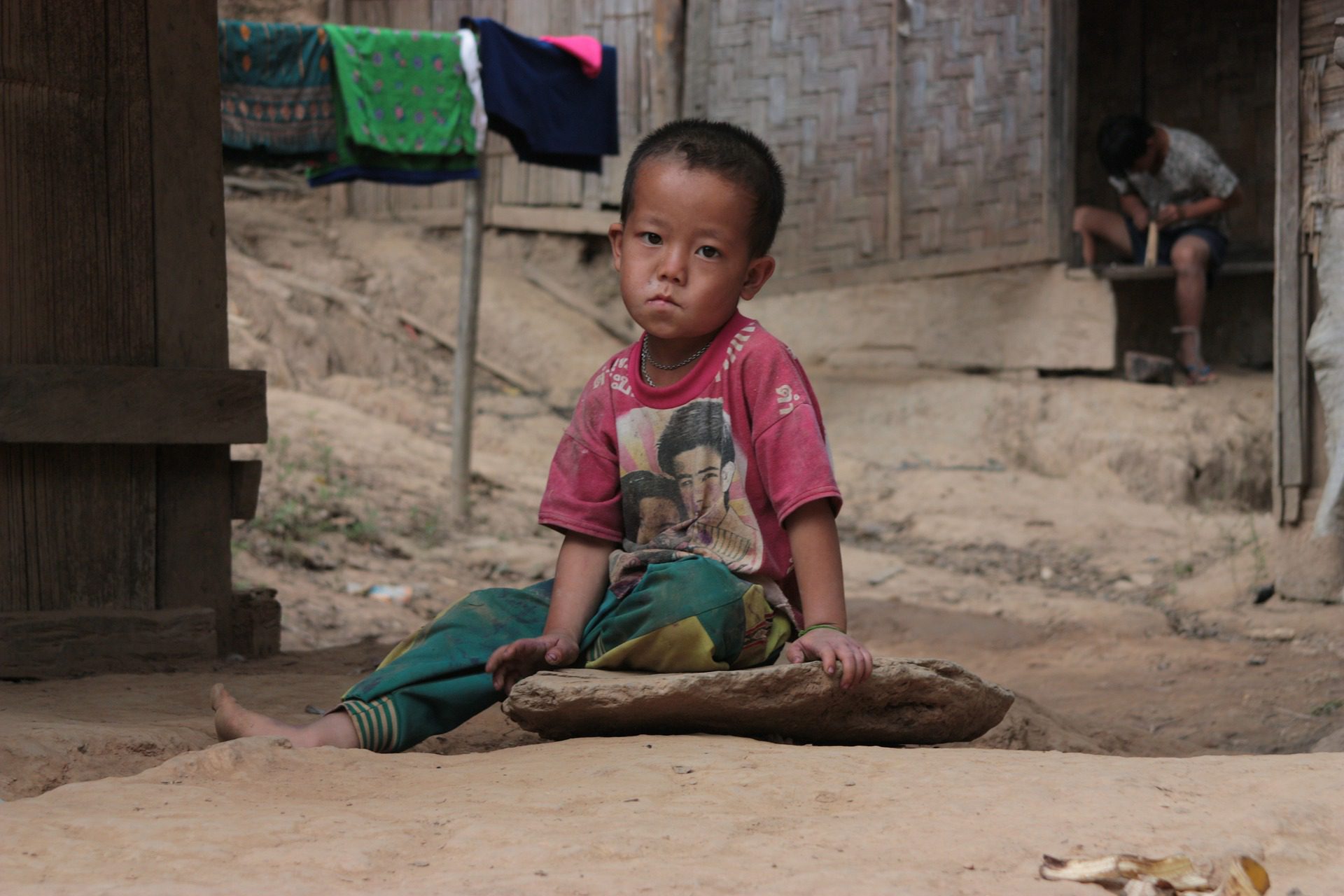 Young boy in poverty in developing region.