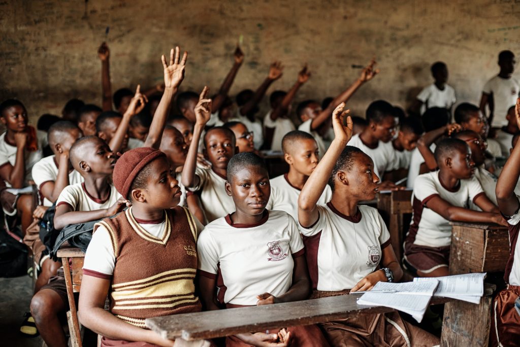 Picture of a classroom in a developing country, filled with students